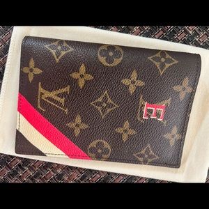Louis Vuitton passport cover, monogrammed with E. Used once,impeccable condition